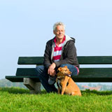 Man with dog on bench